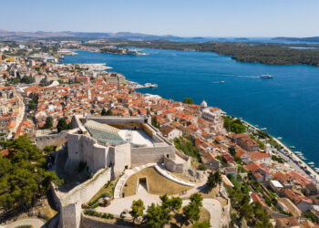 Sibenik, Croatia: Aerial view of the Sibenik St. Michael's Fortress and medieval old town by the Adriatic sea in Croatia on a sunny summer day