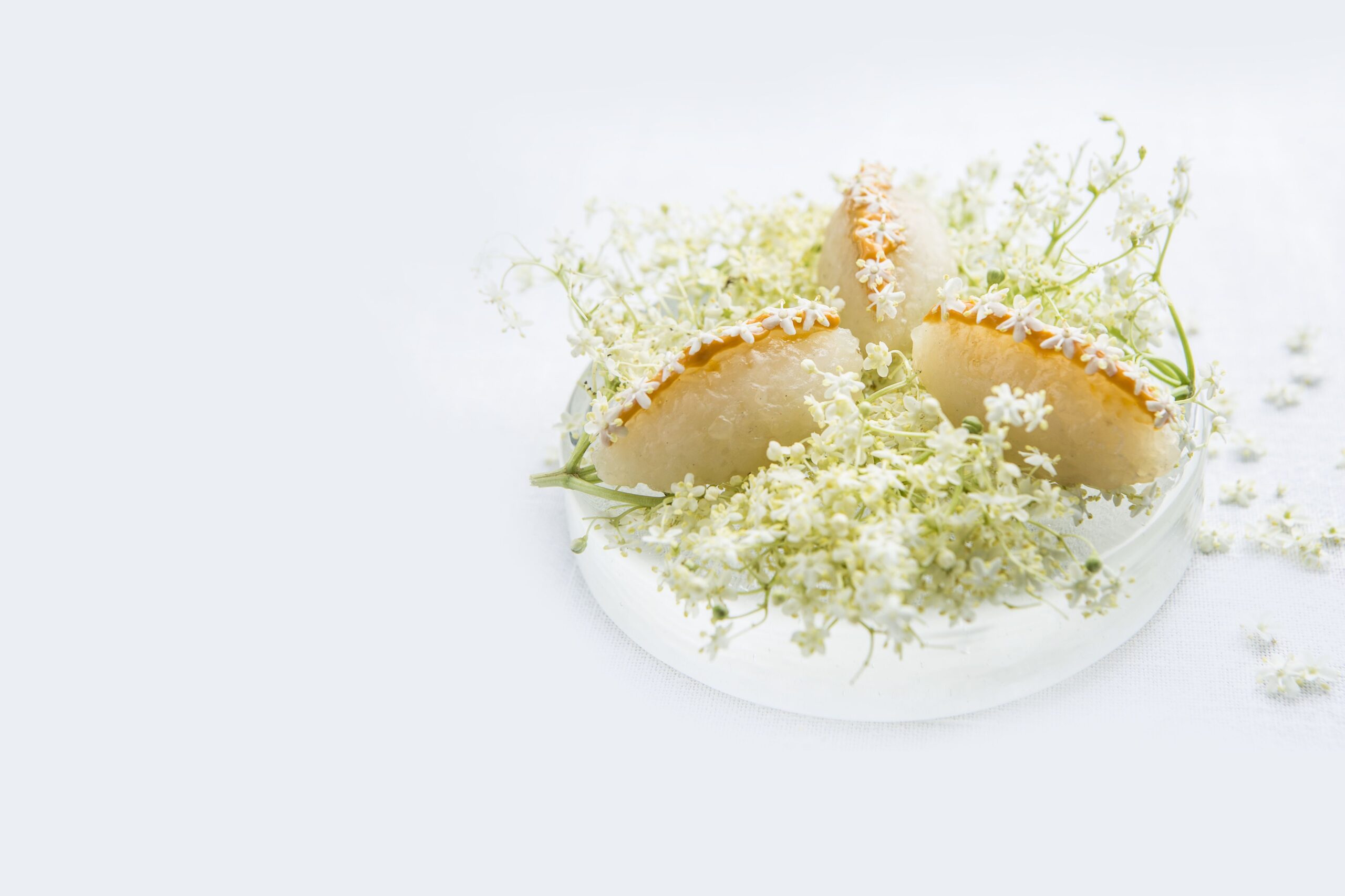 Fine dining dish on a plate of florals