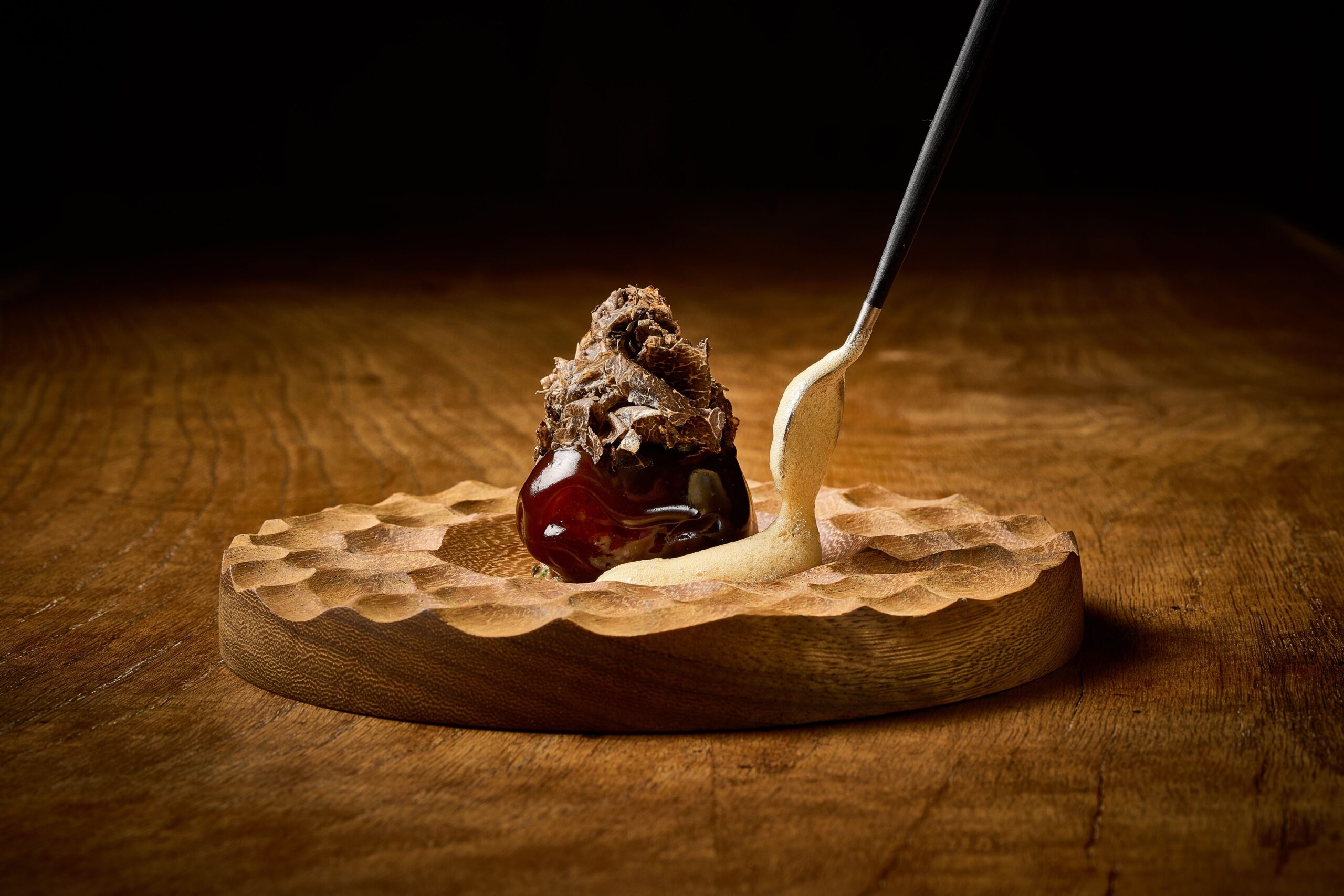 Round dessert on a wooden plate