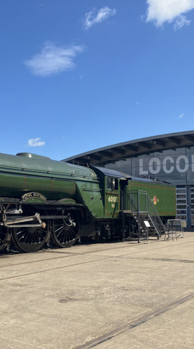 Exterior of Locomotion railway museum in Shildon, complete with a train carriage out front