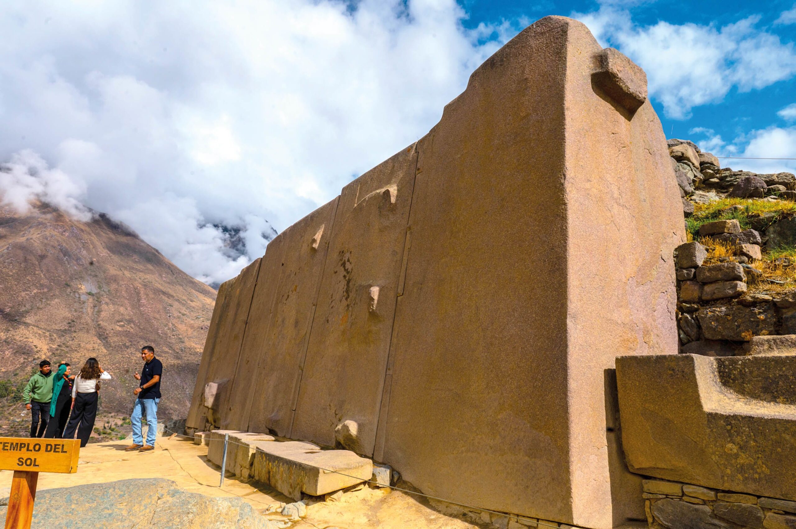 Ollantaytambo’s Sun Temple, you can see a thick yellow wall