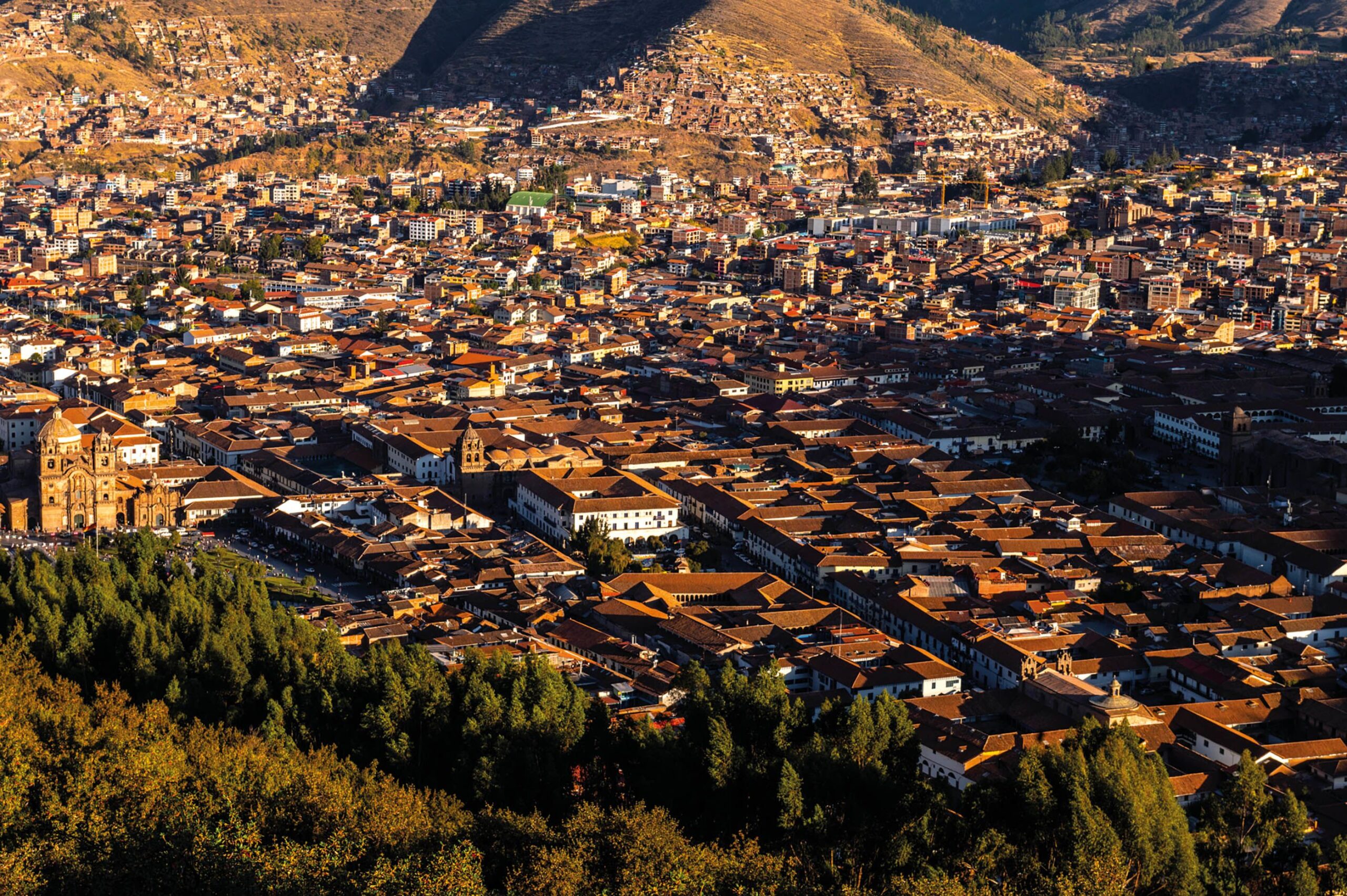 The view of Cusco from Sacsayhuamán. There are multiple homes in the distance