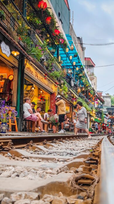 Low-angle shot taken from the track showing Hanoi Train Street