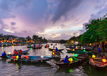 Traditional lantern boats on the river at twilight