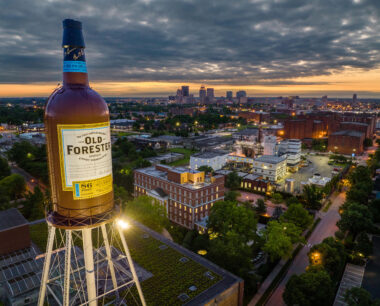 The Brown-Forman tower stands in front of the Louisville skyline at dusk