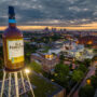 The Brown-Forman tower stands in front of the Louisville skyline at dusk