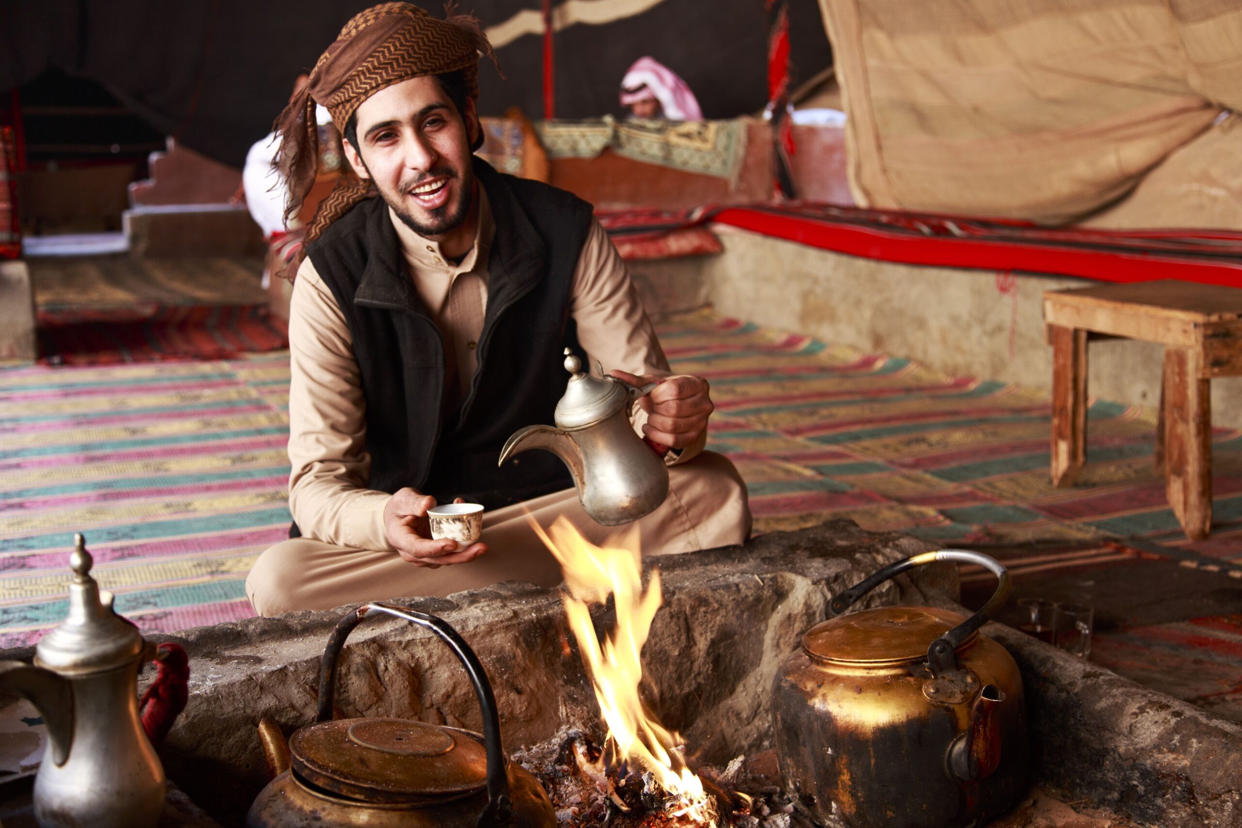 A man boiling coffee in the fire
