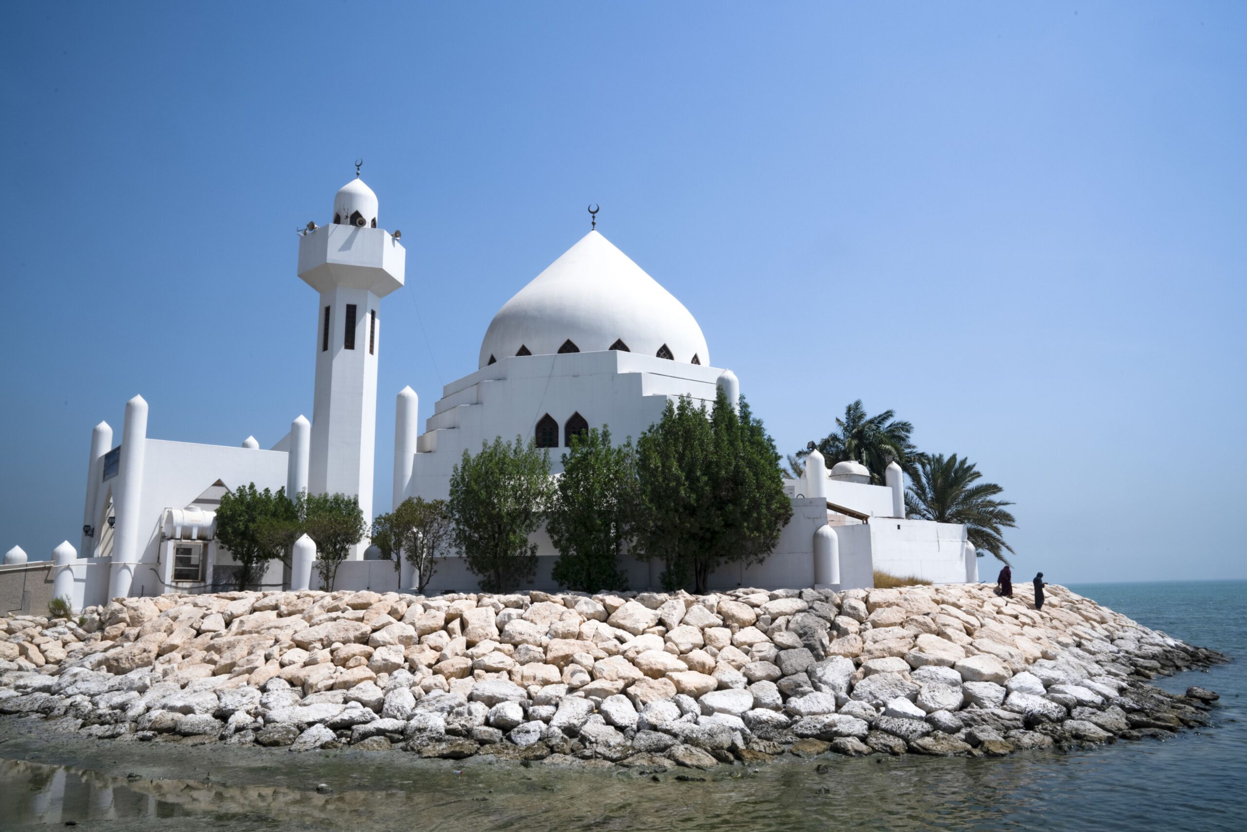 White mosque on a little island